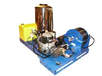 Custom built combination hot water pressure washer and sewer jetter slides into a full size pick-up box for maneuvering easements